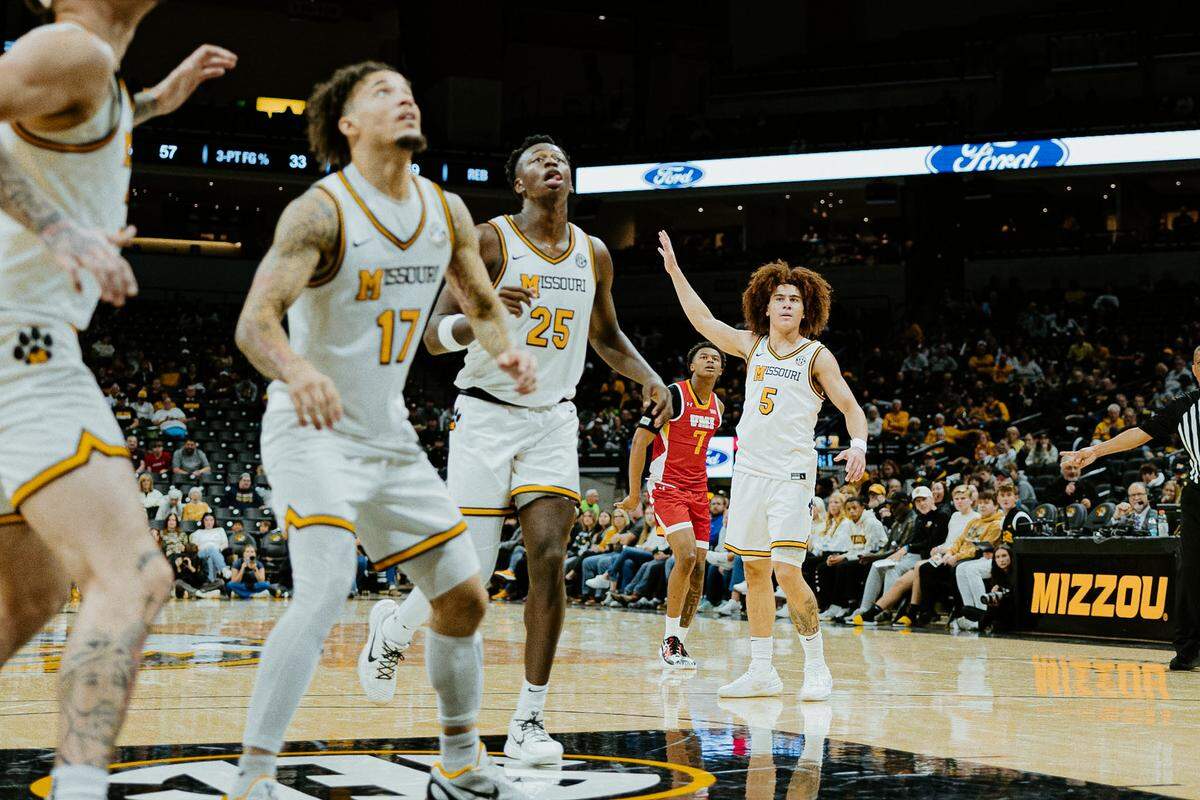 Mark Mitchell (No. 25, middle) watches a shot attempt during a game against VMI at Mizzou Arena in Columbia on Nov. 9, 2025.