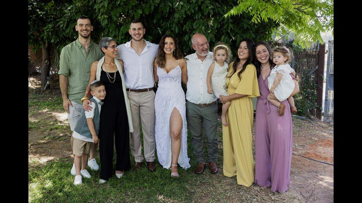 Guy Cohen, Anat Maoz, Amir Maoz, Einav Mor Maoz, Itay Maoz, Adi Maoz and Noam Maoz Cohen stand together for a family portrait. The Maoz family briefly lived in Overland Park before returning to southern Israel. Adi Maoz described how her family survived Saturday’s attack by Hamas on their home.