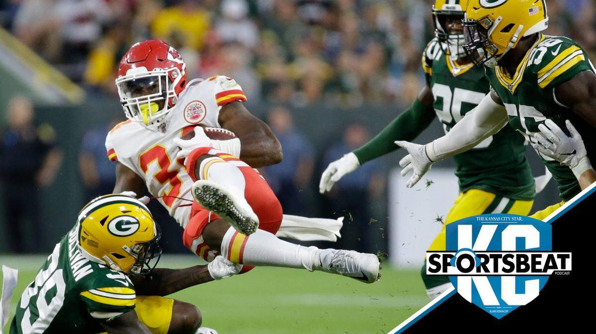 Chiefs running back Carlos Hyde is stopped by Green Bay’s Chandon Sullivan during the first half Thursday.