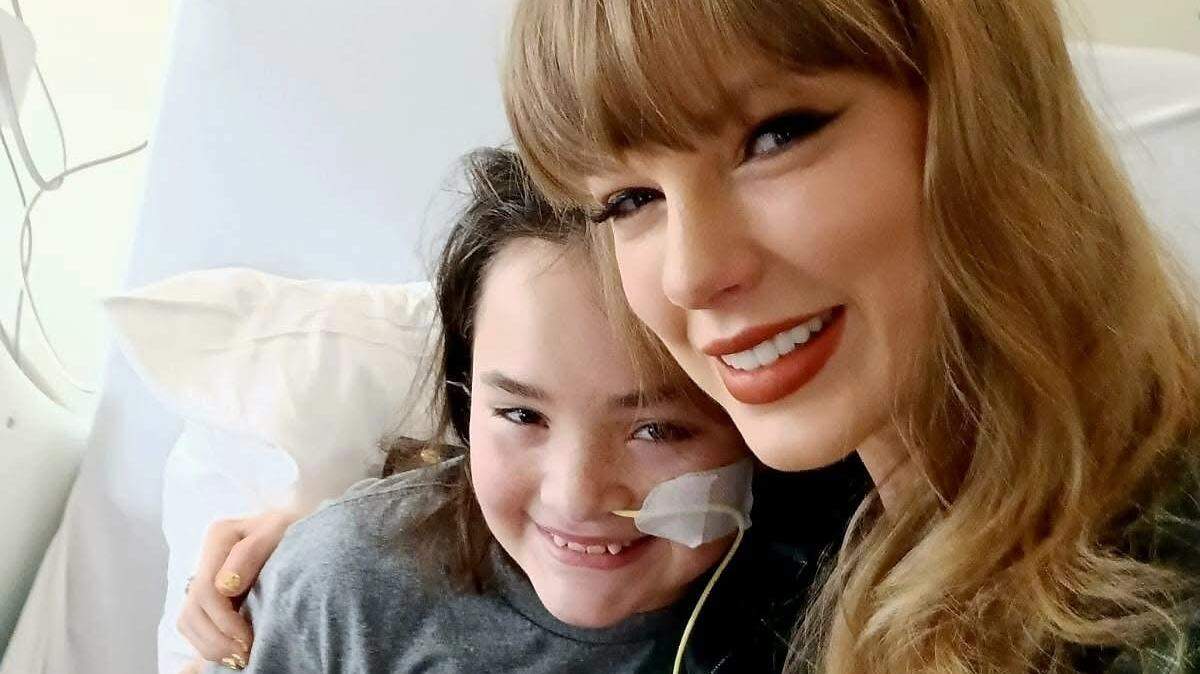 Taylor Swift with Children’s Mercy patient Baylee Nuzum. Swift made a surprise visit to the hospital Thursday.