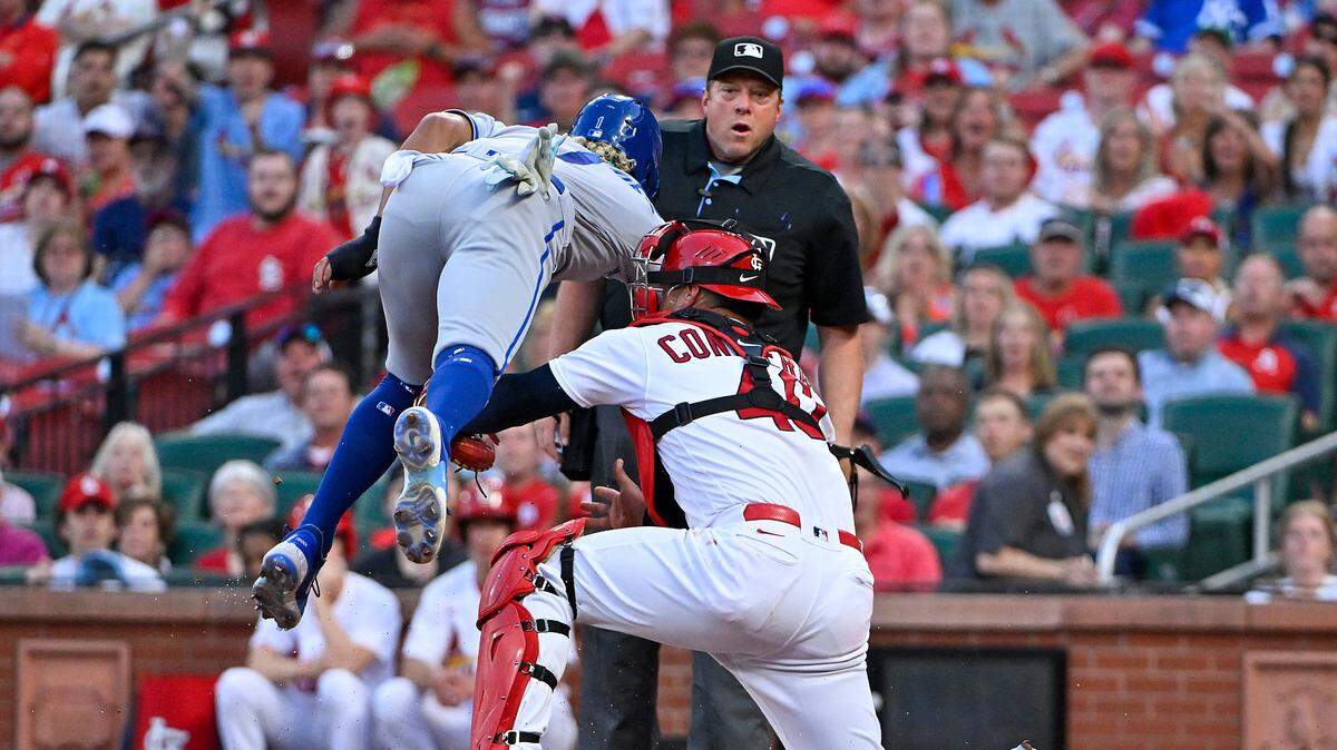 St. Louis Cardinals catcher Willson Contreras (40) tags Kansas City Royals right fielder MJ Melendez (1) at home during the fourth inning at Busch Stadium on May 30, 2023.