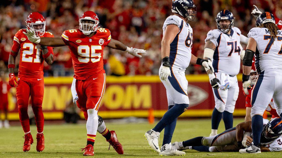 Chiefs defensive tackle Chris Jones (No. 95) celebrates his sack of Denver Broncos quarterback Russell Wilson (on the ground) during Thursday night’s game at GEHA Field at Arrowhead Stadium.