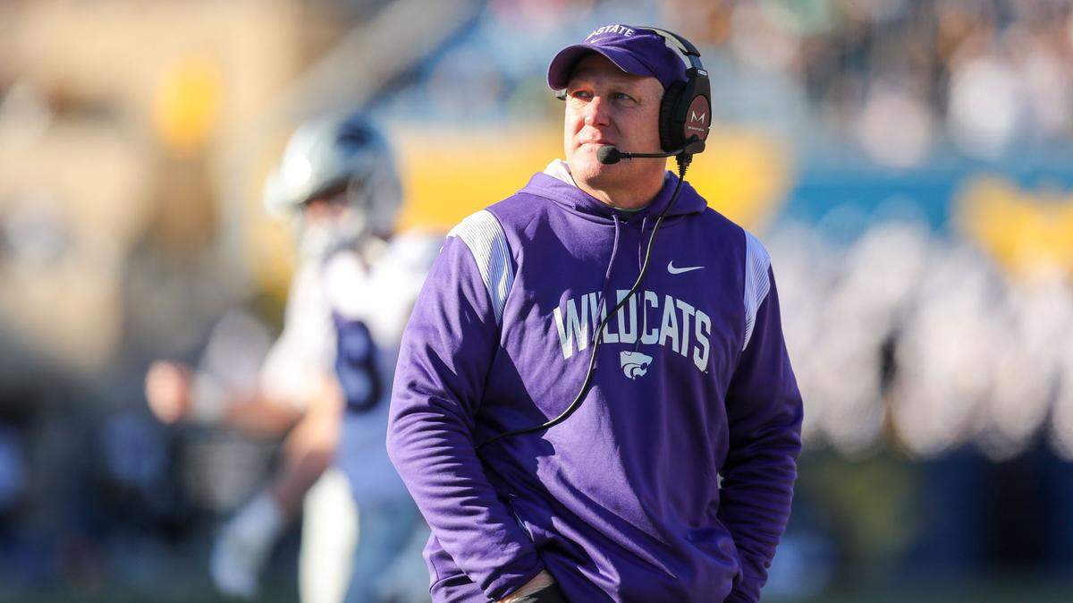 Kansas State Wildcats head coach Chris Klieman watches a replay during the first quarter against the West Virginia Mountaineers at Mountaineer Field at Milan Puskar Stadium on Nov. 19, 2022.