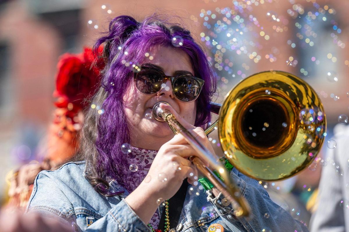 Trombone player Shelly Alexander of the Sass-a-Brass band performs during the Krewe de Prank parade on Sunday, March 2, 2025, in Kansas City.
