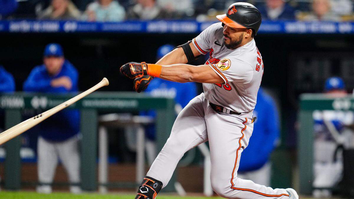 Baltimore Orioles right fielder Anthony Santander (25) loses his bat as he hits a single during the eighth inning against the Kansas City Royals at Kauffman Stadium.