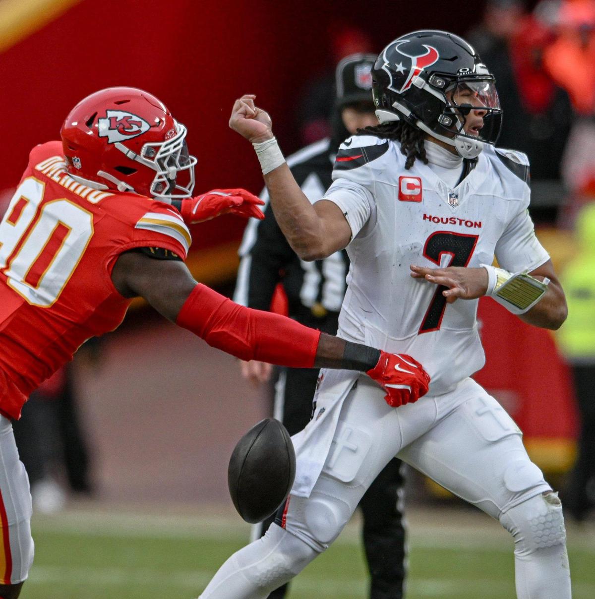 Kansas City Chiefs defensive end Charles Omenihu, left, knocks the ball from of the hand of Houston Texans quarterback C.J. Stroud during an AFC Divisional Round playoff game on Saturday, Jan. 18, 2025, at GEHA Field at Arrowhead Stadium.