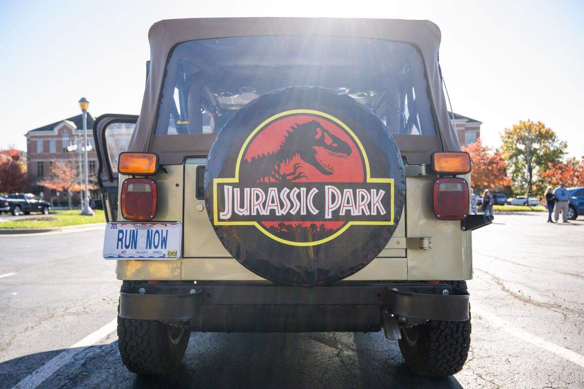 The “Jurassic Park” Jeep has a license plate with a line from the movie, “Run now.”