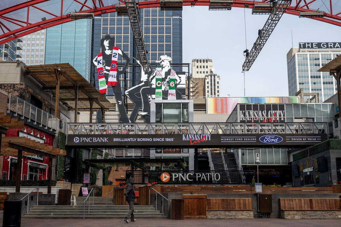 The PBR Big Sky cowgirl figures are seen wrapped in custom-knit scarves at the Kansas City Power & Light District on Sunday, March 1, 2026.