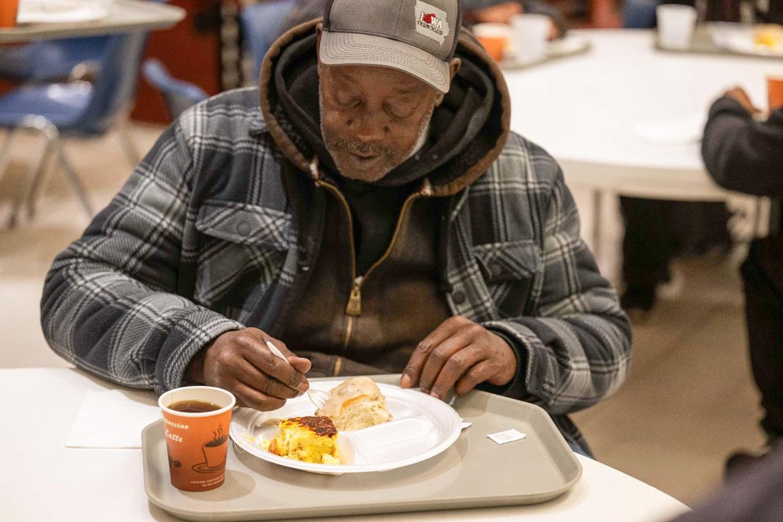 Roscoe, also known as ‘George of the Jungle’, enjoys a plate of food served at Morning Glory Ministries, a morning breakfast program run by the Catholic Diocese of Kansas City-St. Joseph at 9th Street and Baltimore Avenue.