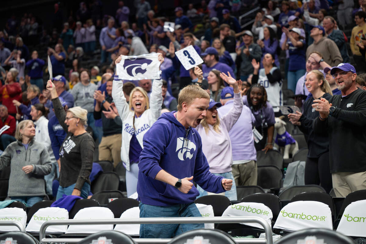 The Kansas State Wildcat fanbase erupts after a late three-point basket was made against Oklahoma State during the Big 12 Women’s Basketball Tournament.