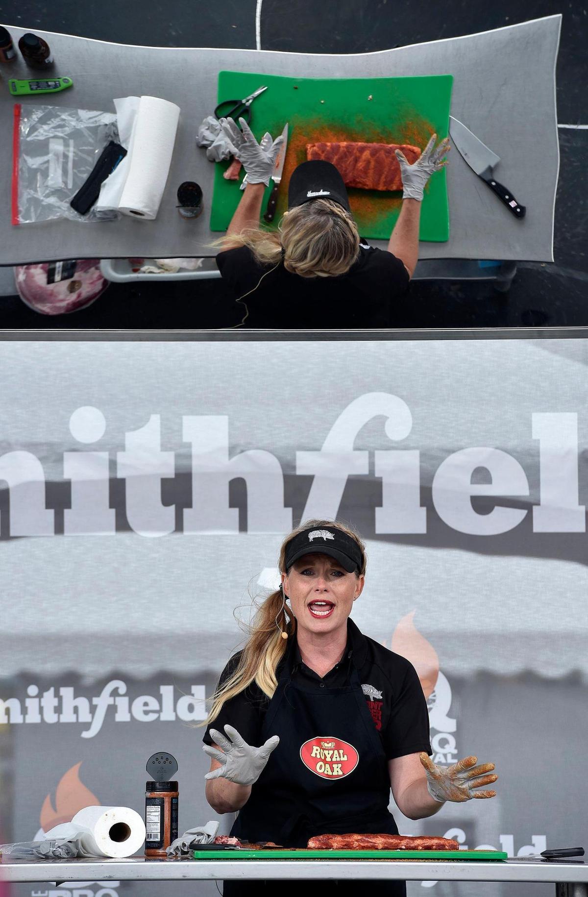 Megan Day of Burnt Finger BBQ does a demonstration on competition rib preparation. The three-day Kansas City BBQ Festival in the parking lot of the GEHA Field at Arrowhead Stadium concluded Sunday, July 11, 2021.