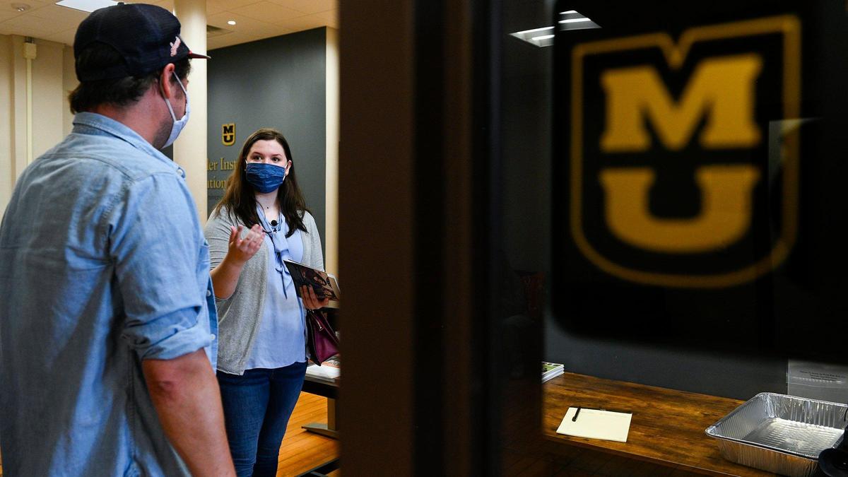 Allison Smith, a student at the University of Missouri-Columbia, met with political science professor Thomas Kane, left, for the first time on August 20.. The two had been chatting on line for six months. Kane is director of undergraduate studies at the Kinder Institute on Constitutional Democracy.