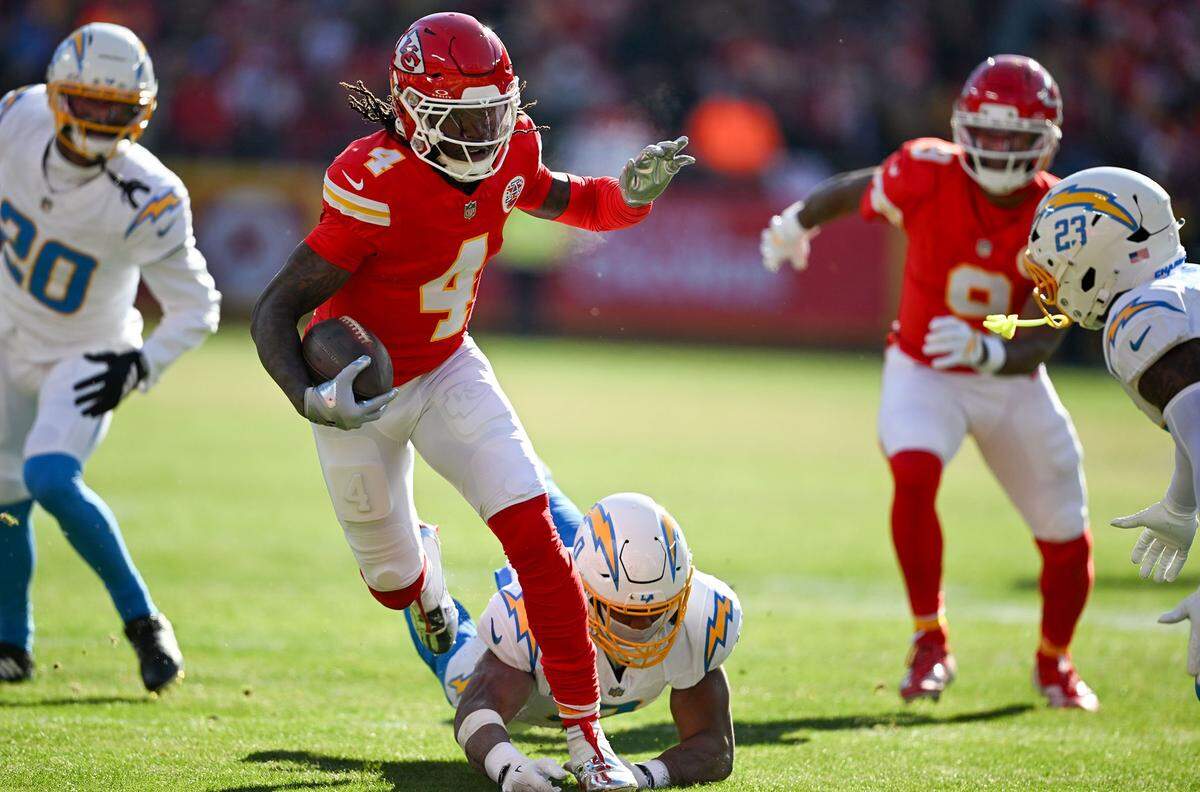 Kansas City Chiefs wide receiver Rashee Rice (4) runs after a catch against the LA Chargers at GEHA Field at Arrowhead Stadium on Sunday, Dec. 14, 2025.