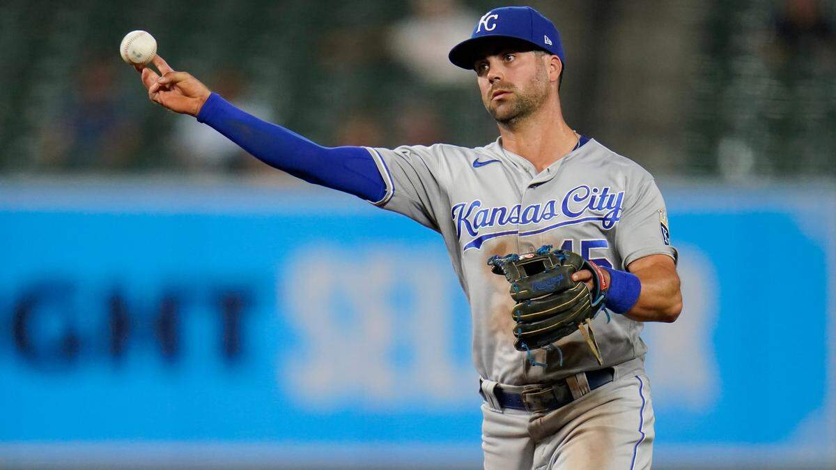 Kansas City Royals second baseman Whit Merrifield throws out a Baltimore Orioles runner at first base during the fourth inning of a baseball game, Tuesday, Sept. 7, 2021, in Baltimore. (AP Photo/Julio Cortez)