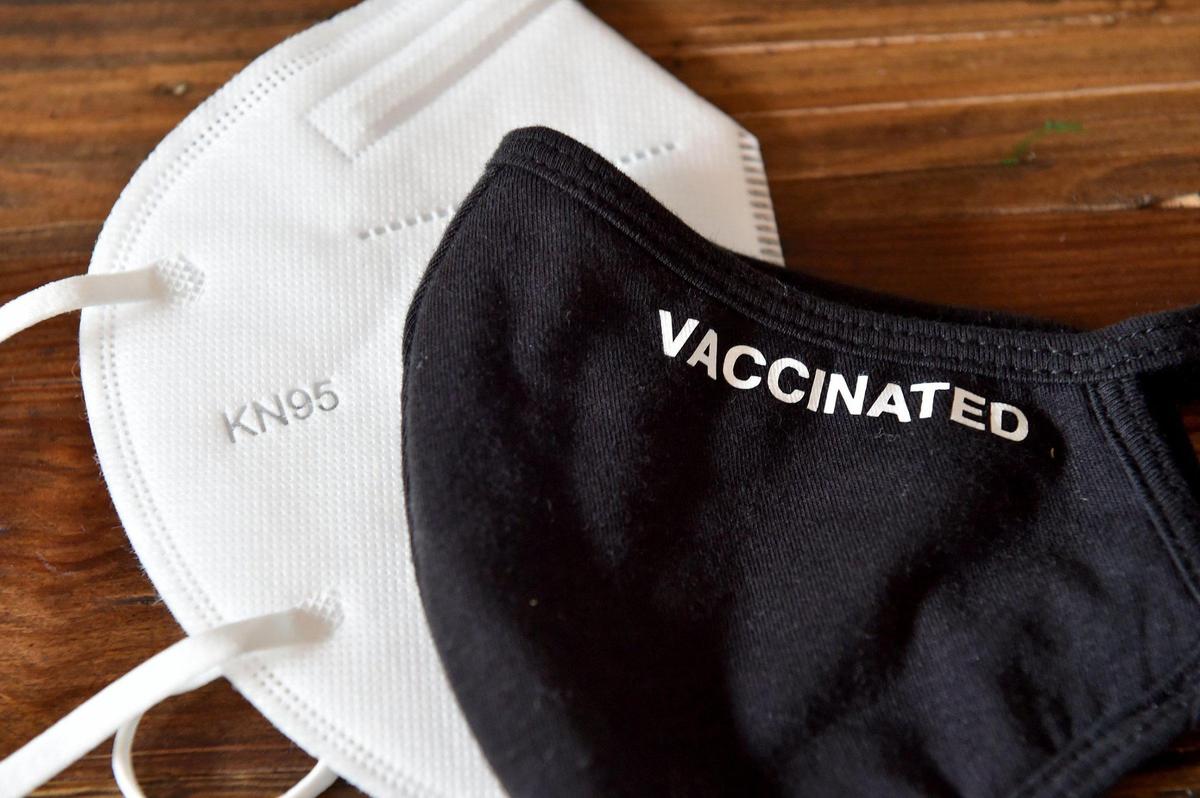 Sarah Dubin is a Kansas City pulmonary and critical care physician. Her six-year-old will start first grade next month in the Blue Valley school district. Students who have not been vaccinated do not have to wear masks, a rule Dubin said was frustrating. One of Dubin’s masks clearly states her vaccination status.