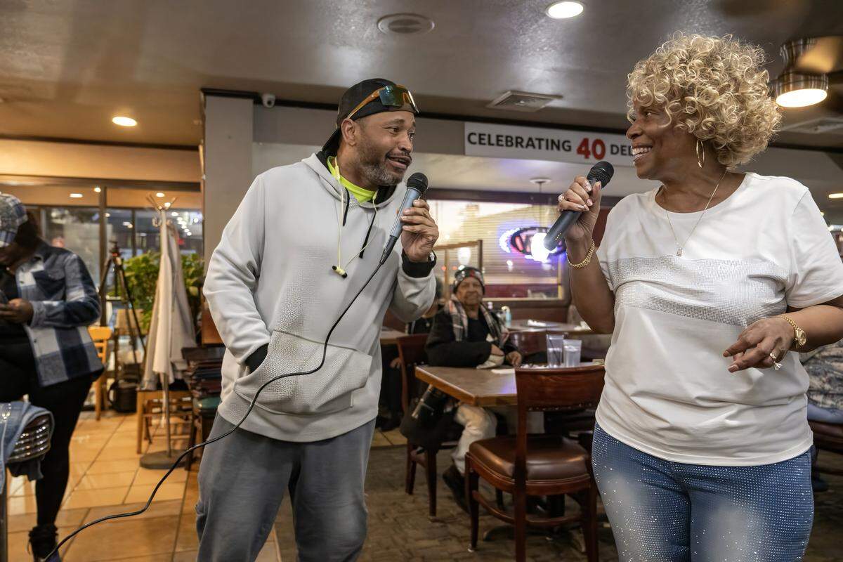 Hank Robinson of Kansas City performs "The Closer I Get to You," a duet with owner Denise “Ms. Niecie” Ward, during "Dinner & A Show" on Friday, Feb. 6, 2026, at Niecie's Restaurant in Kansas City.
