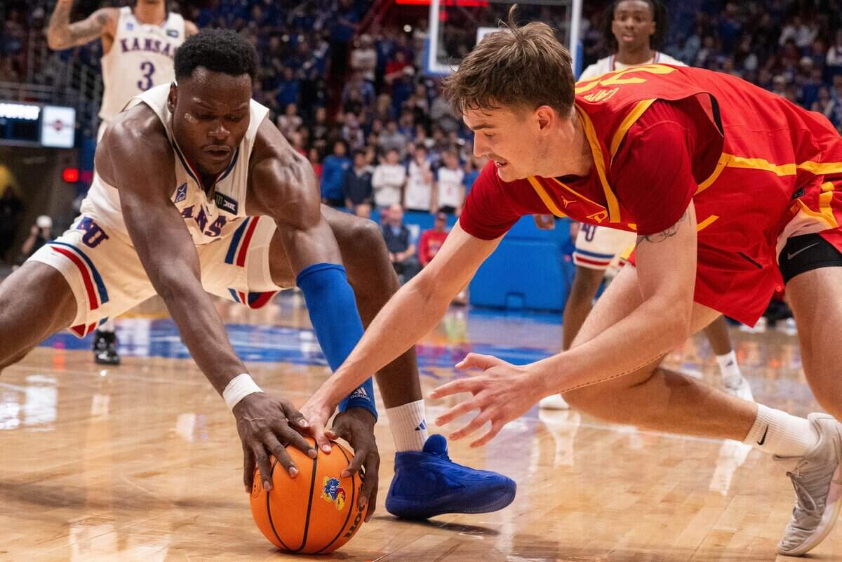 Kansas Jayhawks center Paul Mbiya fights for the ball against Pittsburgh State center Charles Caporaso in the Jayhawks exhibition game vs. Pittsburg State Gorillas, on Friday, October 16, 2026, at Allen Fieldhouse. The exhibition game, a first for Late Night in the Phog, replaces the normal format of variety show style sketches and a team scrimmage.