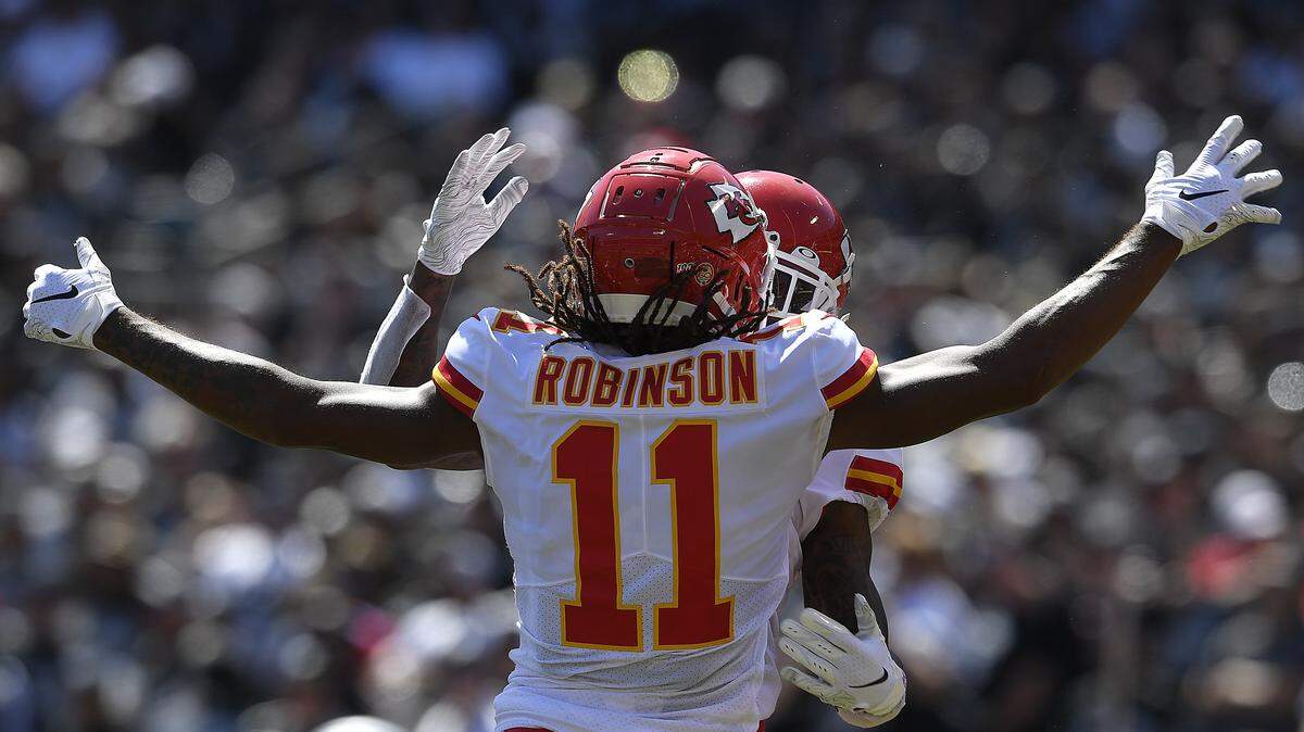 The Chiefs’ Demarcus Robinson (11) celebrates his touchdown with teammate Mecole Hardman during the first half of the Chiefs’ 28-10 win Sunday at Oakland Alameda Coliseum.