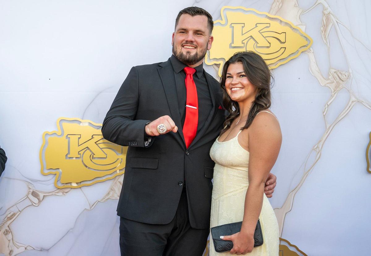 Kansas City Chiefs offensive lineman Mike Caliendo and girlfriend Olivia Storm on the red carpet before the Super Bowl LVIII championship ring presentation event.