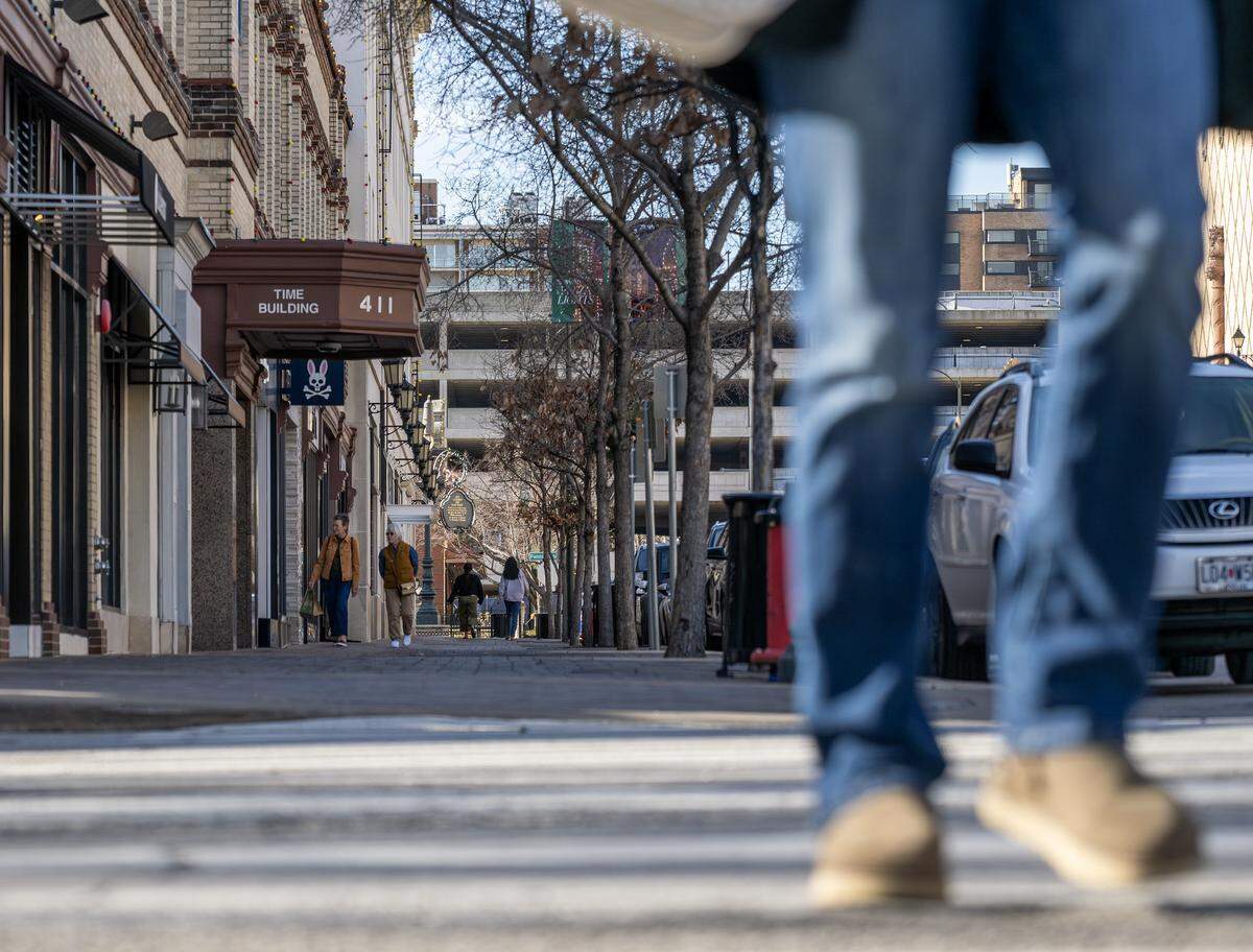 Pedestrians walk along Nichols Road at the Country Club Plaza on Tuesday, Dec. 16, 2025, in Kansas City.