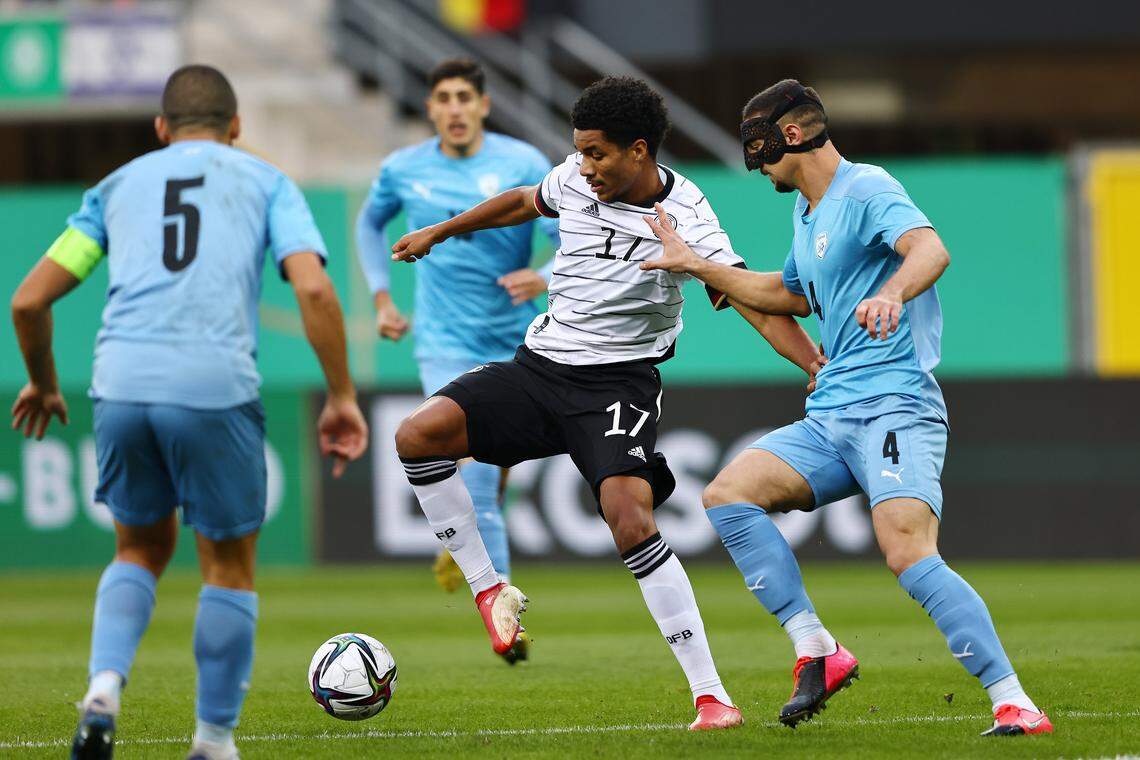 Or Blorian of Israel, right, pressures Germany’s Malik Tillmann during a UEFA European Under-21 Championship qualifier at Benteler Arena in Paderborn, North Rhine-Westphalia, Germany on Oct. 7, 2021.