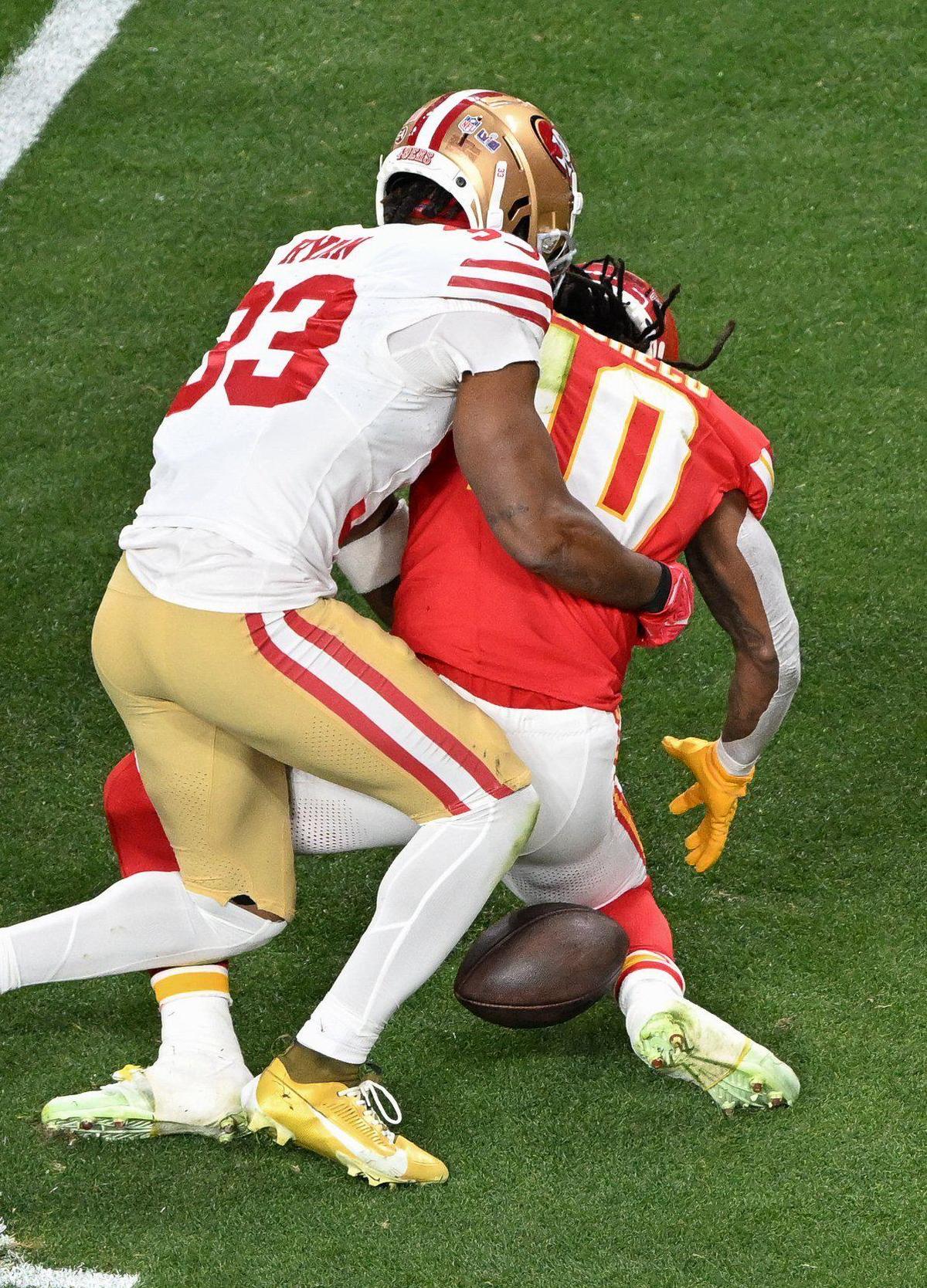 Kansas City Chiefs running back Isiah Pacheco (10) fumbles while in the grasp of San Francisco 49ers safety Logan Ryan in the second quarter of Super Bowl LVIII, Sunday, Feb. 11, 2024, in Las Vegas. San Francisco recovered the ball.