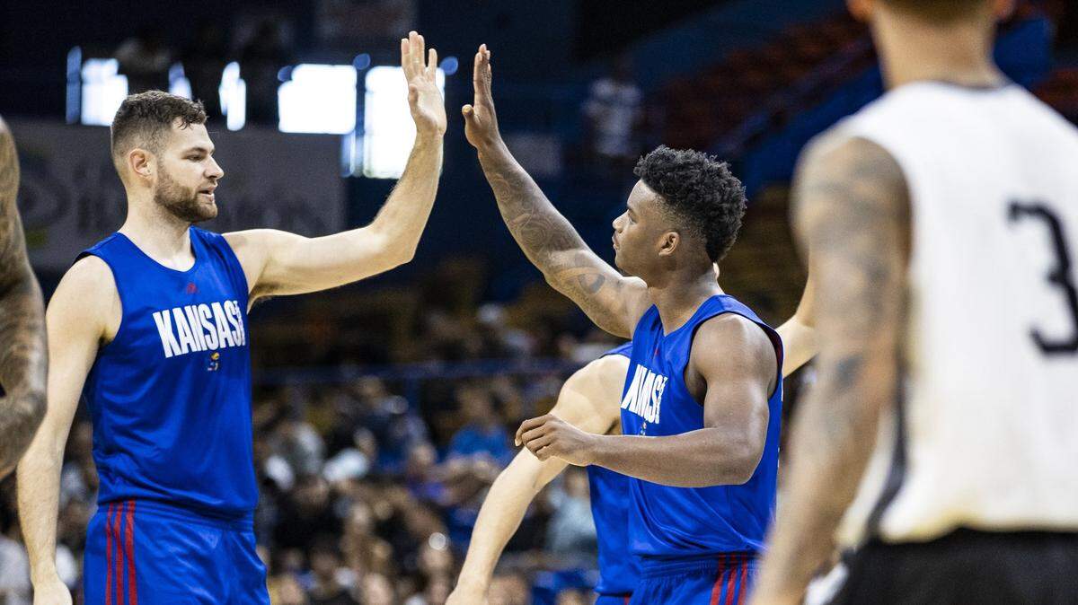 Hunter Dickinson and KJ Adams high-five during KU basketball’s August 2023 summer trip to Puerto Rico, which featured three exhibition games.