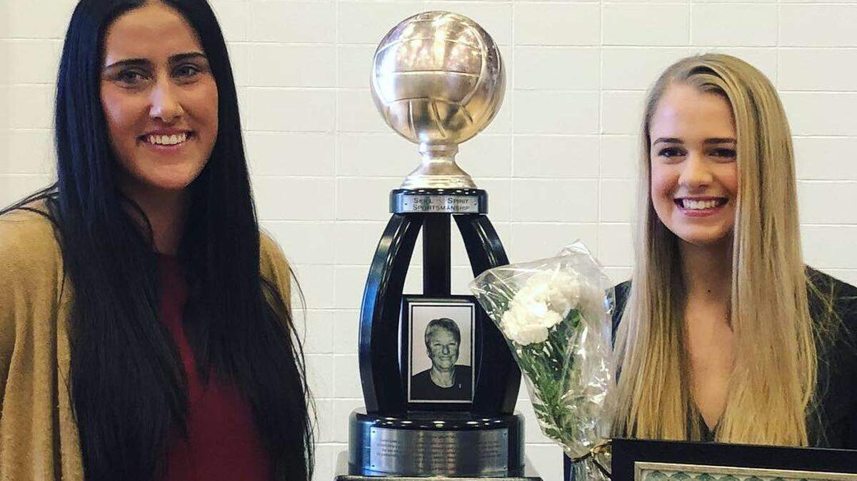 Ellie Bichelmeyer (right) of St. Teresa’s Academy on Tuesday won the 14th annual Evelyn Gates Award, presented to the top high school volleyball player in the Kansas City area.