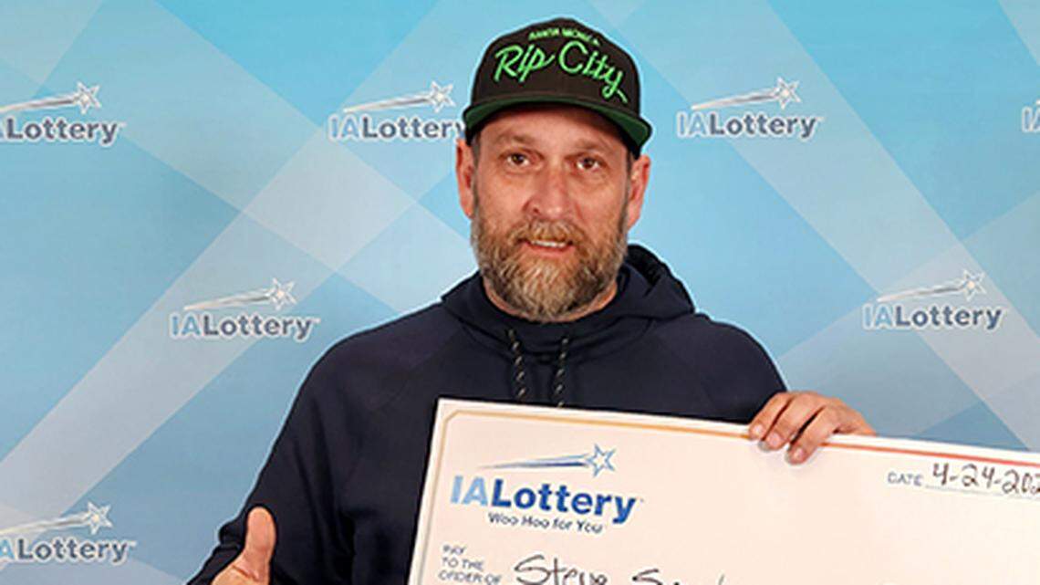 Stephen “Steve” Snyder with his oversized check.