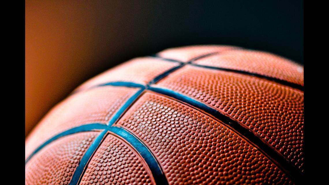 An Ohio basketball coach and players are accused of attacking a referee during a tournament in Indiana, officials say.