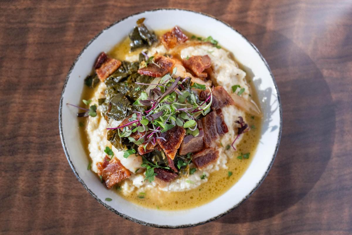 The shrimp and grits at Urban on Armour and Troost features tiger shrimp, collard greens, gouda grits and a healthy portion of bacon.