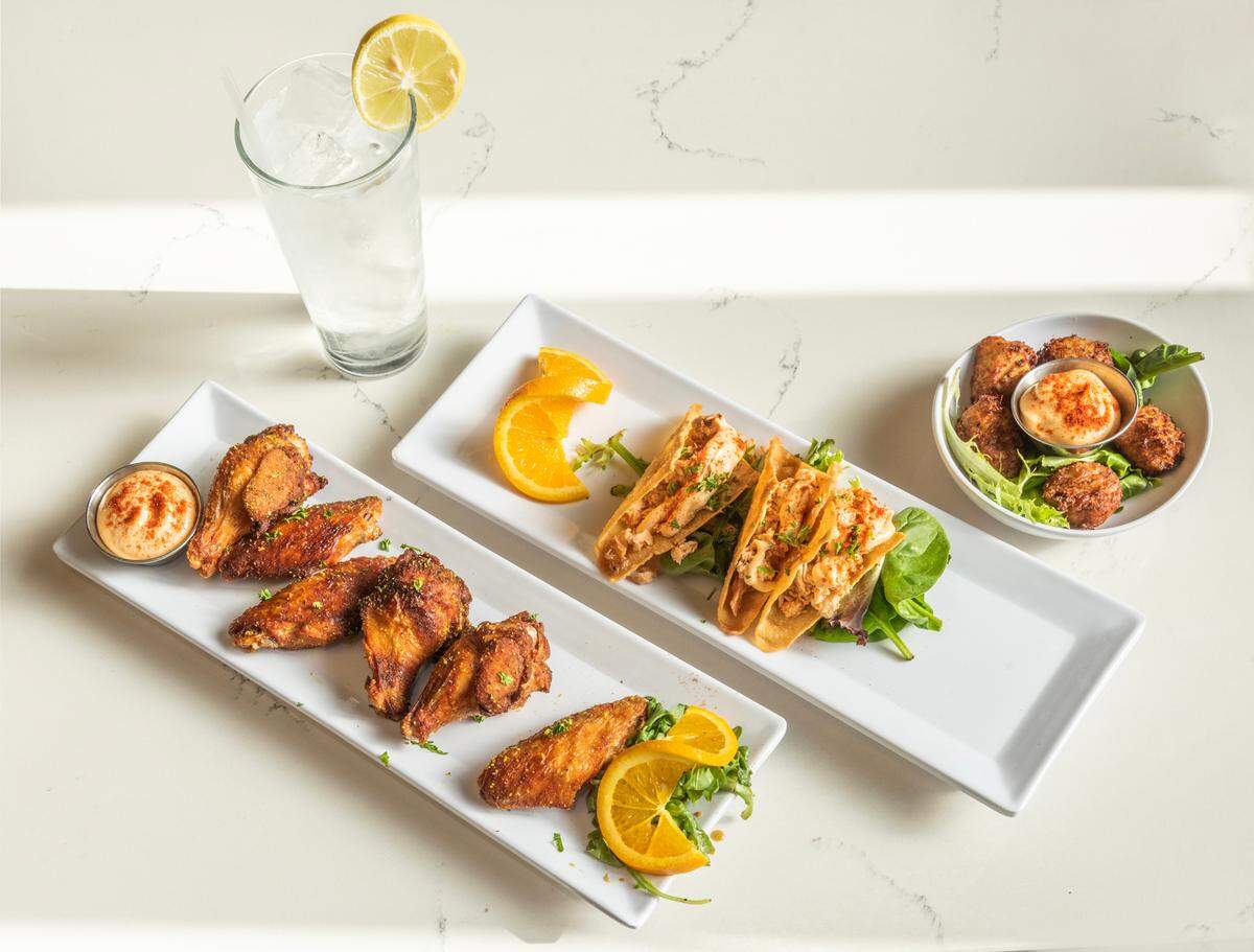 Spicy Salmon Sashimi Tacos, paired with Lemon Grass Ginger Wings at Boho Sway at the Canary.