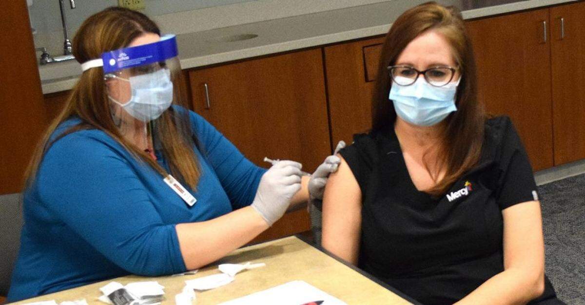 In December, Tracy Hill, right, a nurse at Mercy Hospital Springfield, was one of the first two people to get the COVID-19 vaccine in the city. “I remember getting my vaccine and coming out here afterwards, and sitting in my car and crying. I felt so hopeful,” she said. Now, she says, she cries in despair.