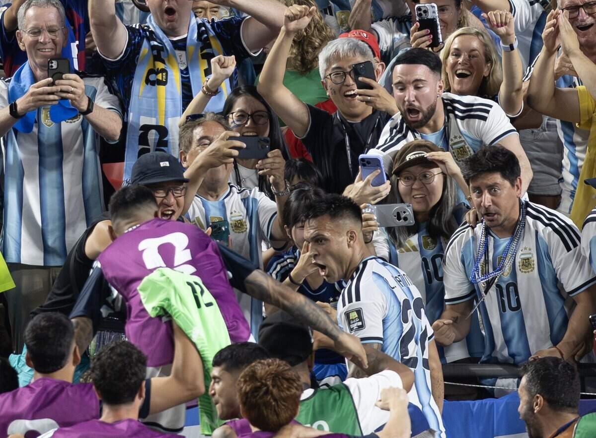 Argentina forward Lautaro Martínez (22) celebrates in the stands after scoring a goal late in extra time to ensure Argentina's win over Switzerland during the FIFA World Cup quarterfinal match at Kansas City (Arrowhead) Stadium in Kansas City on Saturday, July 11, 2026.
