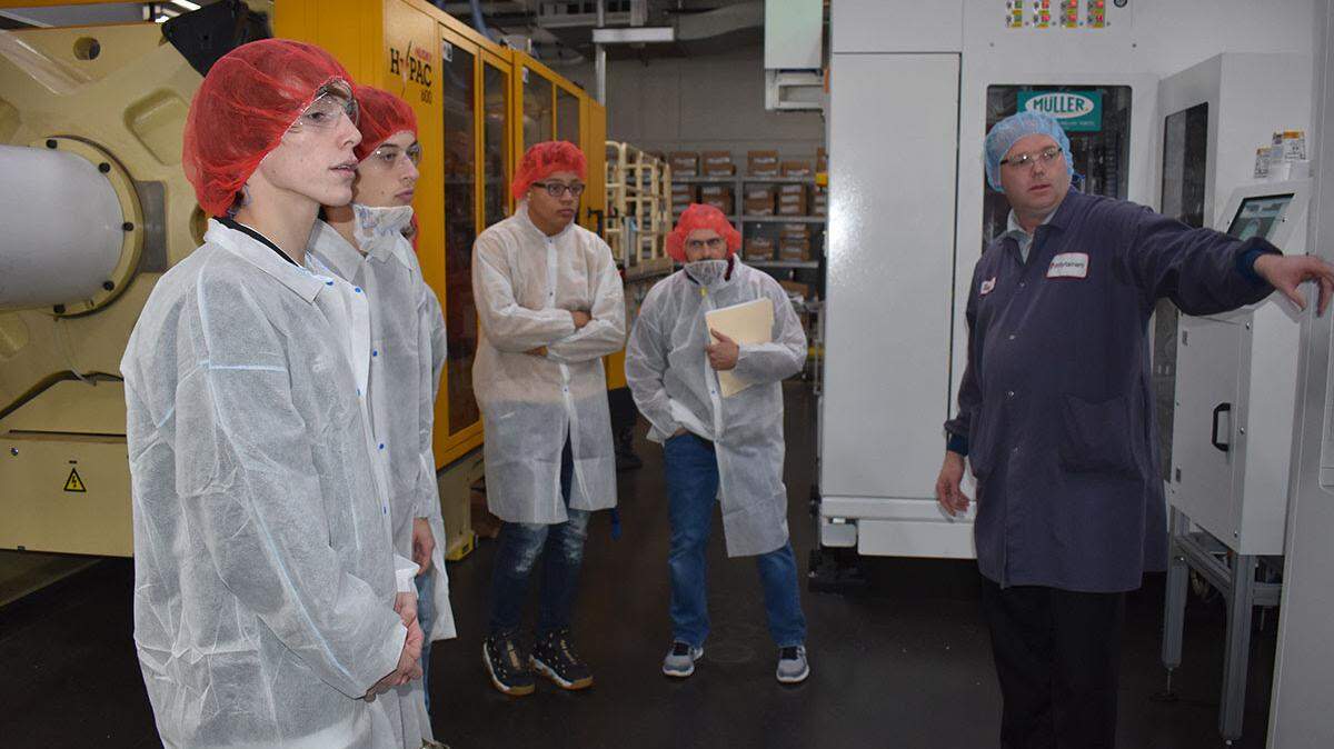 Students from Lee’s Summit North High School learn about the diverse career paths open to them at Polytainers, a plastics manufacturer in Lee’s Summit.
