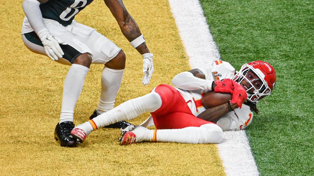 Kansas City Chiefs wide receiver Xavier Worthy (1) hauls in a pass for a touchdown past the defense of Philadelphia Eagles safety C.J. Gardner-Johnson (8) in the third quarter during Super Bowl LIX on Sunday, Feb. 9, 2025, in New Orleans.