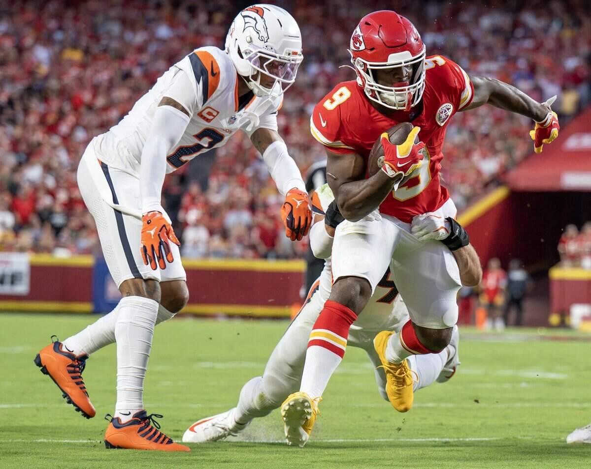 Kansas City Chiefs running back Kenneth Walker III (9) runs the ball in the first quarter during the season opener against the Denver Broncos at Arrowhead Stadium on Monday, Sept. 14, 2026, in Kansas City.
