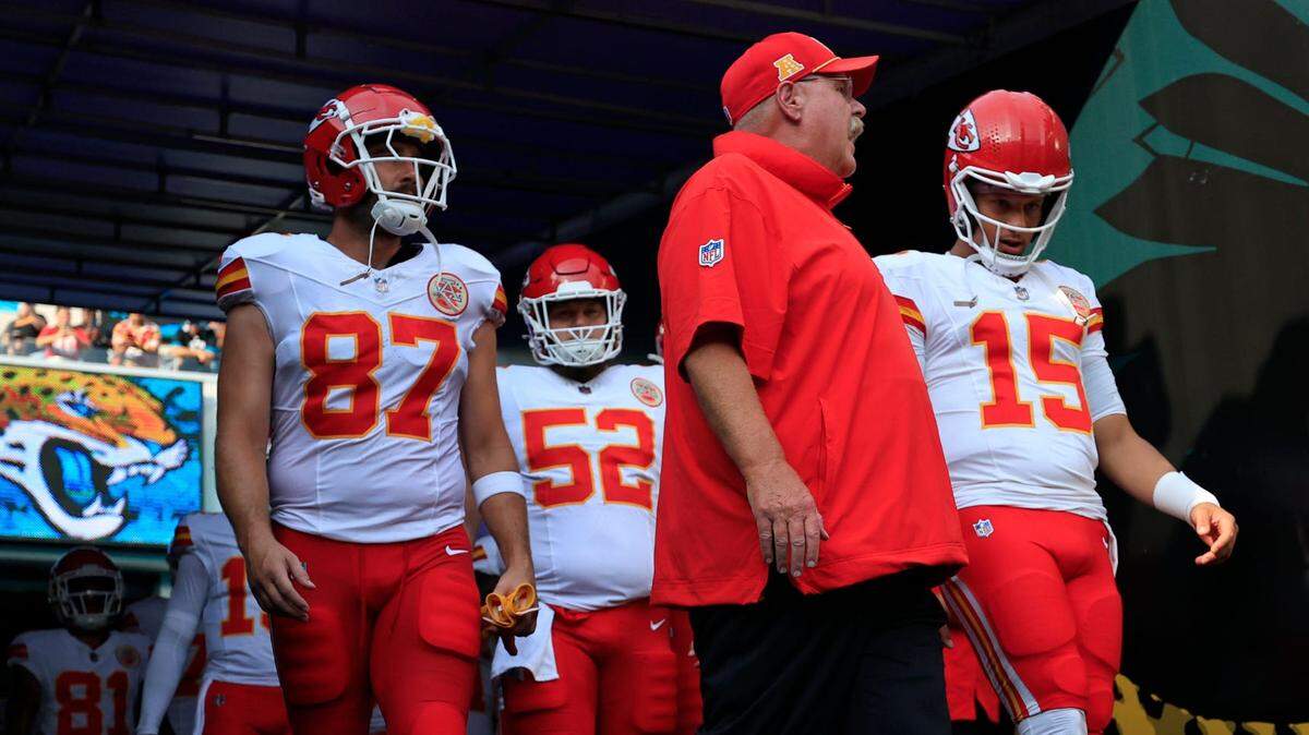 Kansas City Chiefs head coach Andy Reid, center, talks to quarterback Patrick Mahomes (15) next to tight end Travis Kelce (87) before a preseason NFL football game on Aug. 10, 2024 at EverBank Stadium in Jacksonville, Florida.