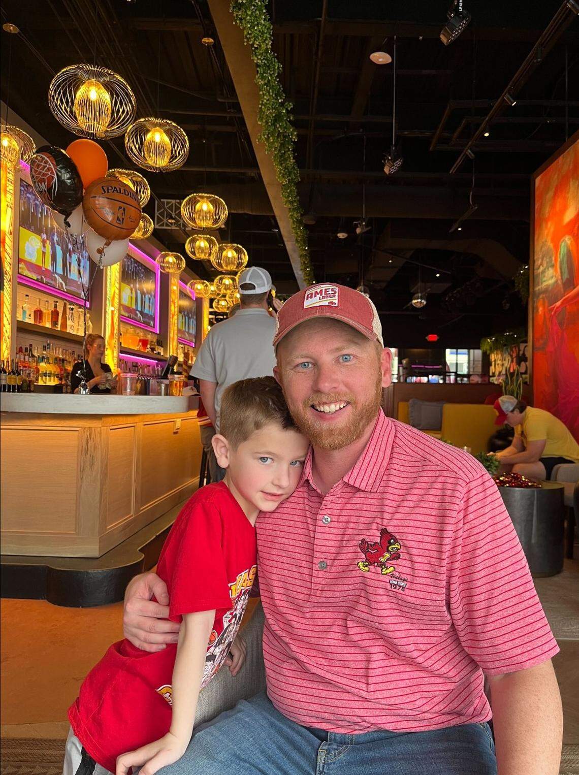 Brent Blum, picture with 7-year-old son Everett, is an Iowa State alum and partner with We Will Collective, contributing to the university’s Name, Image, Likeness fund. Iowa State fans take over bars around Kansas City, including Besos & Abrazos downtown, for the Big 12 basketball tournaments.