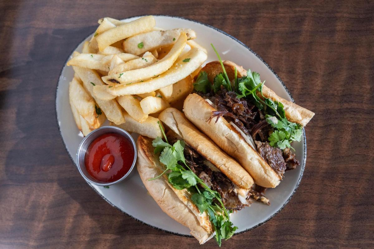 The Oxtail Bahn Mi at Urban on Armour and Troost features oxtail, candied jalapeños and kimchi mayo and is served with fries.
