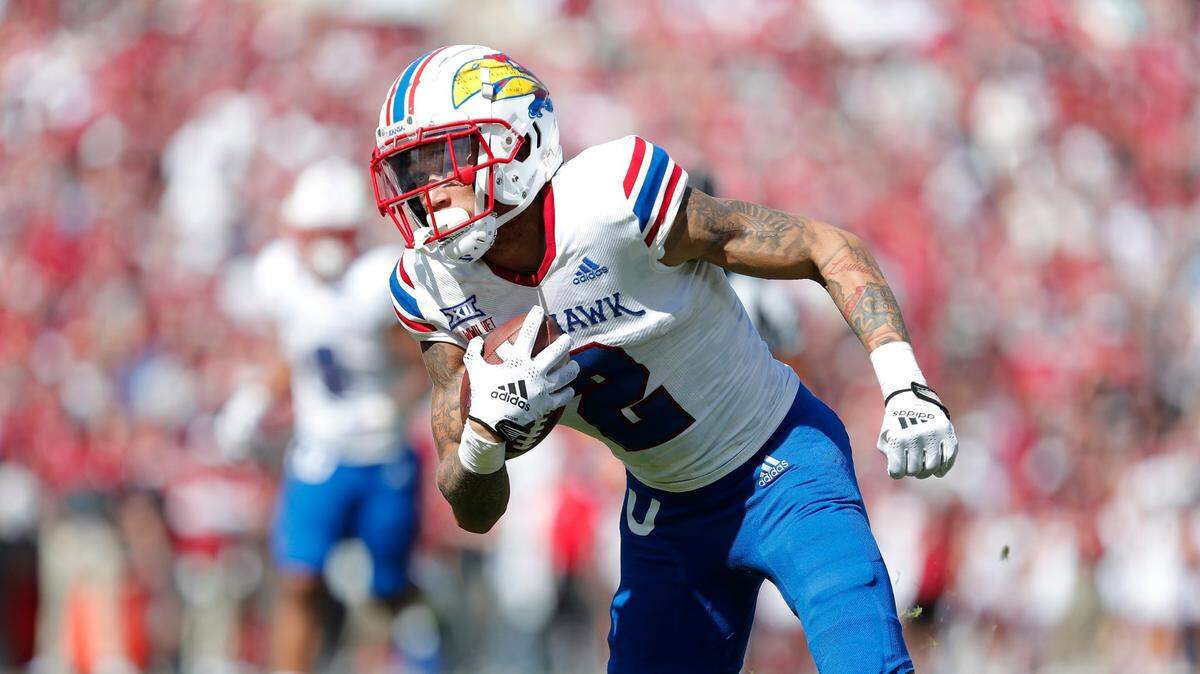 Kansas wide receiver Lawrence Arnold runs for a first down against Oklahoma during the second half on Saturday, Oct. 15, 2022, in Norman, Okla. Oklahoma won 52-42.