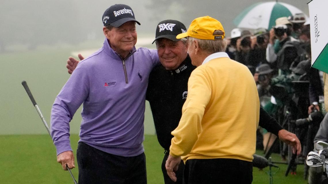 Tom Watson, left, Gary Player and Jack Nicklaus, right, hug during the honorary-starter ceremony before the first round of the Masters on Thursday in Augusta, Ga.