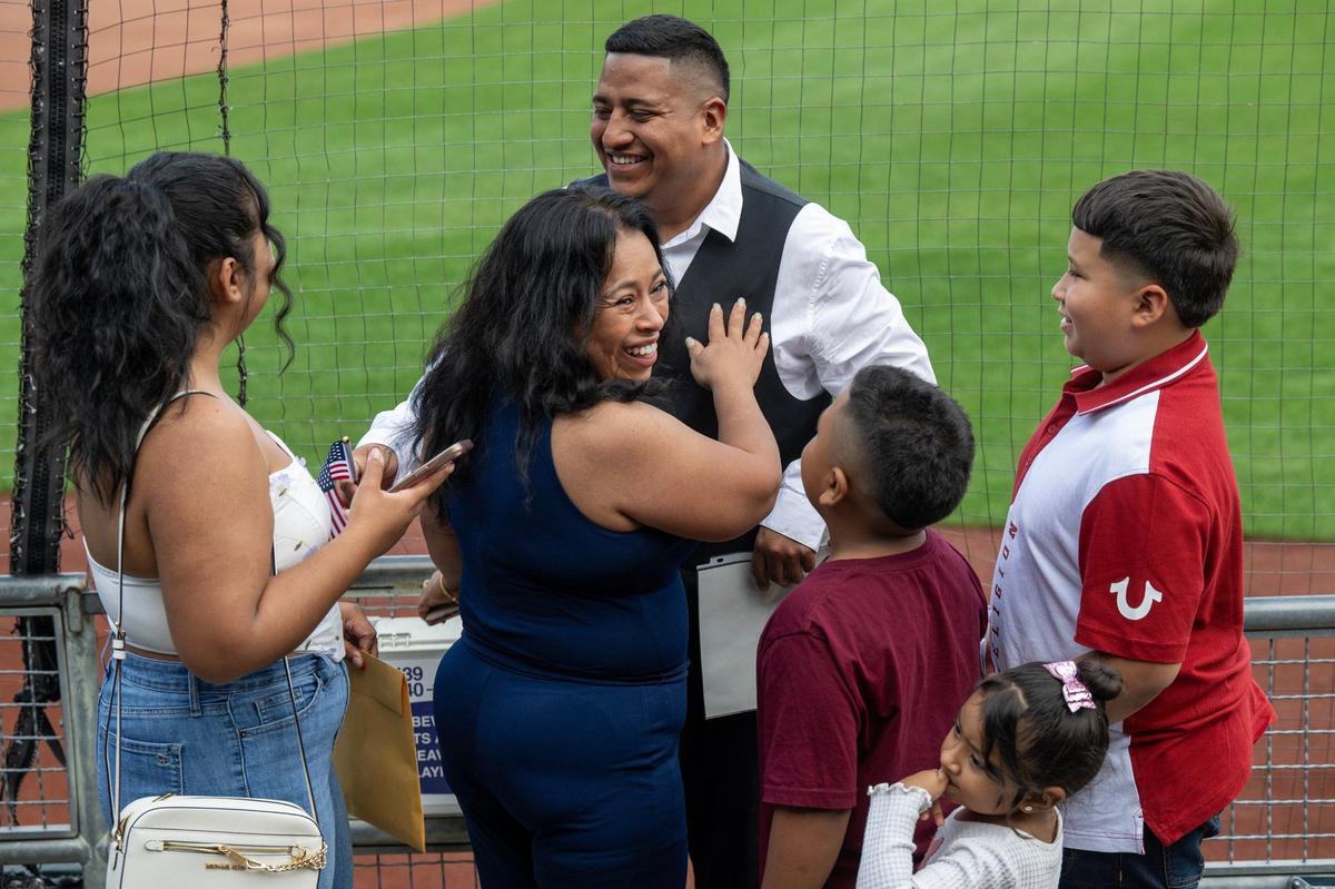 Jonathan Castro, 29, center, celebrated with his family after becoming an American citizen Thursday.