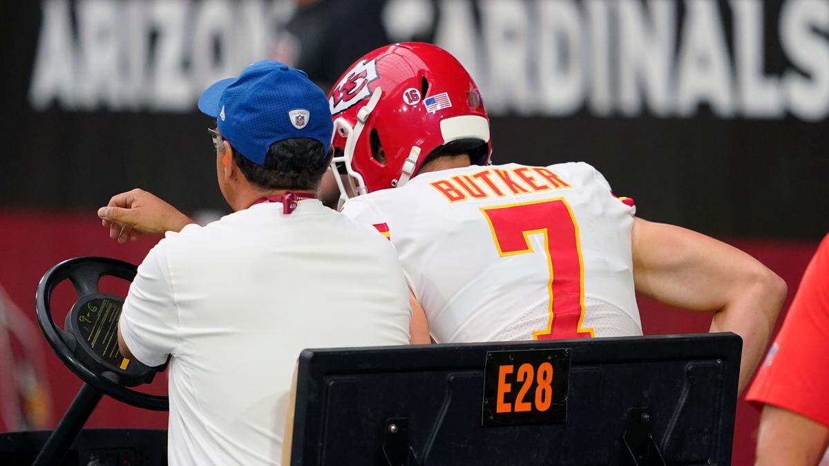 Kansas City Chiefs place kicker Harrison Butker (7) is taken off the field during the first half of an NFL football game against the Arizona Cardinals, Sunday, Sept. 11, 2022, in Glendale, Ariz.