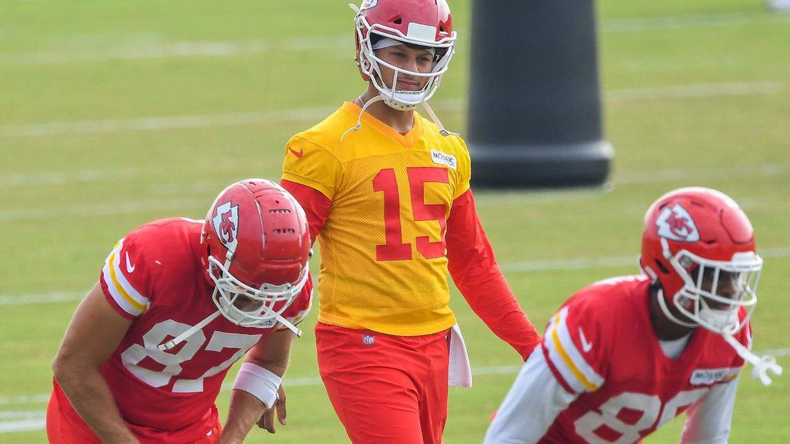 Tight end Travis Kelce, quarterback Patrick Mahomes and tight end Jody Fortson stretch during the Kansas City Chiefs training camp at Missouri Western State University in St. Joseph Friday, Aug. 6, 2021.