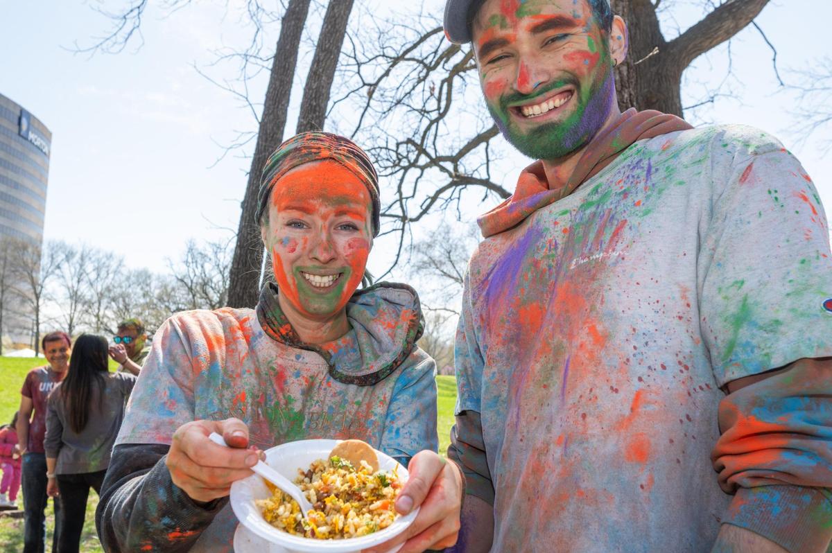 Danny Benavides and Amanda Drouhard celebrate the Hindu celebration of Holi in Overland Park on Sunday.