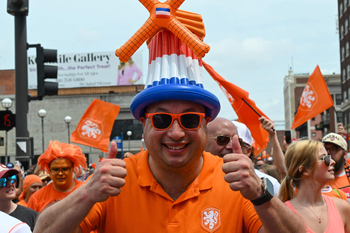 A dutch fan sporting a hat with the flag of the Netherlands and the country’s iconic windmills at the Netherlands Orange Walk from Kansas City’s Power & Light District to FIFA Fan Fest on June 25, 2026.