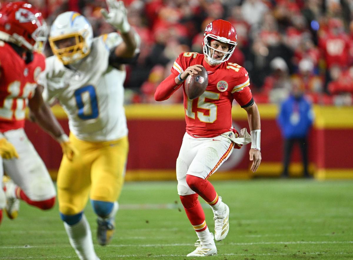 Kansas City Chiefs quarterback Patrick Mahomes (15) scrambles for yardage against the Los Angeles Chargers in the fourth quarter on Sunday, Dec. 8, 2024, at GEHA Field at Arrowhead Stadium.