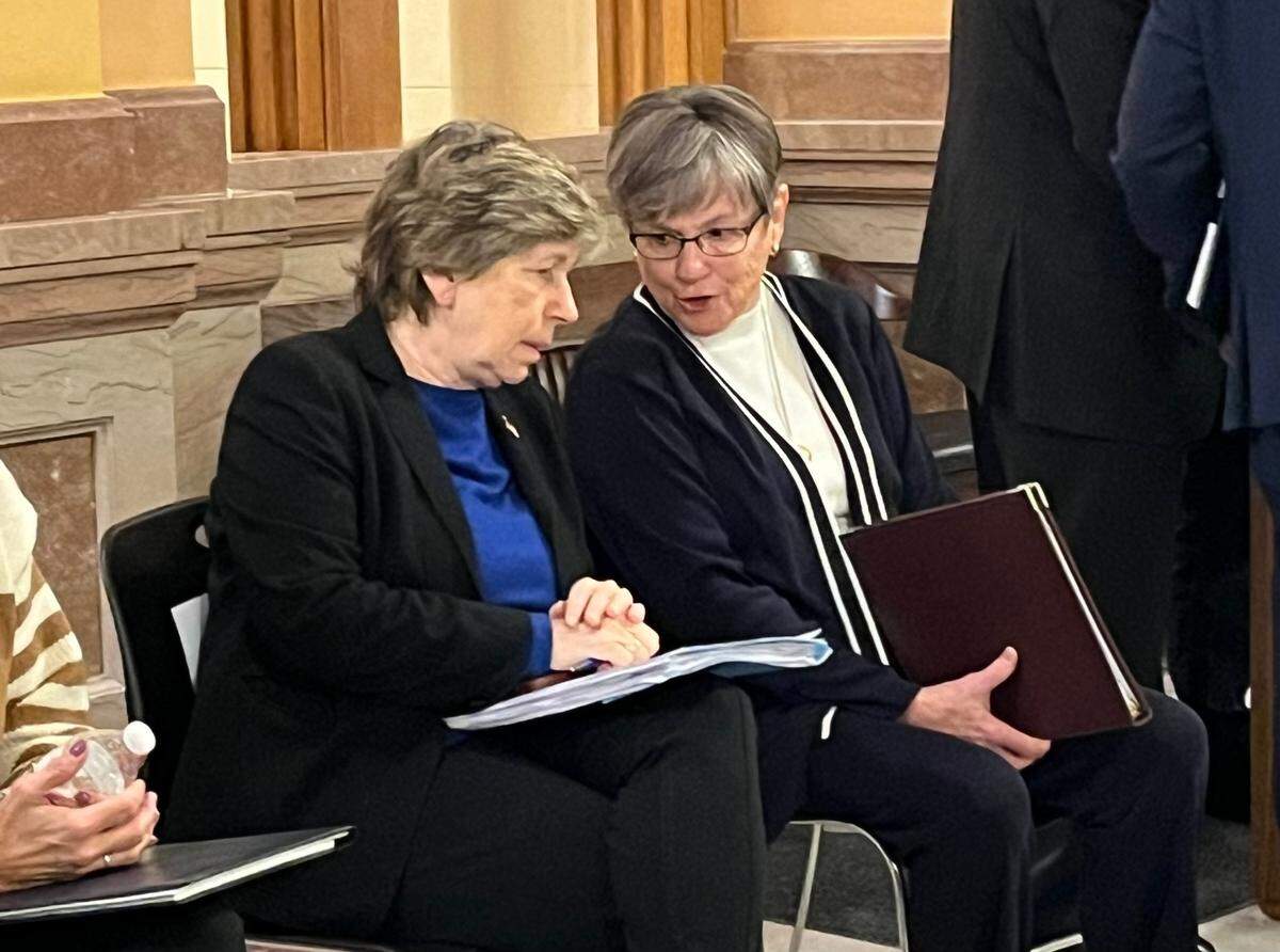 Randi Weingarten, left, speaks with Kansas Gov. Laura Kelly ahead of a labor rally in the Kansas Statehouse last month.