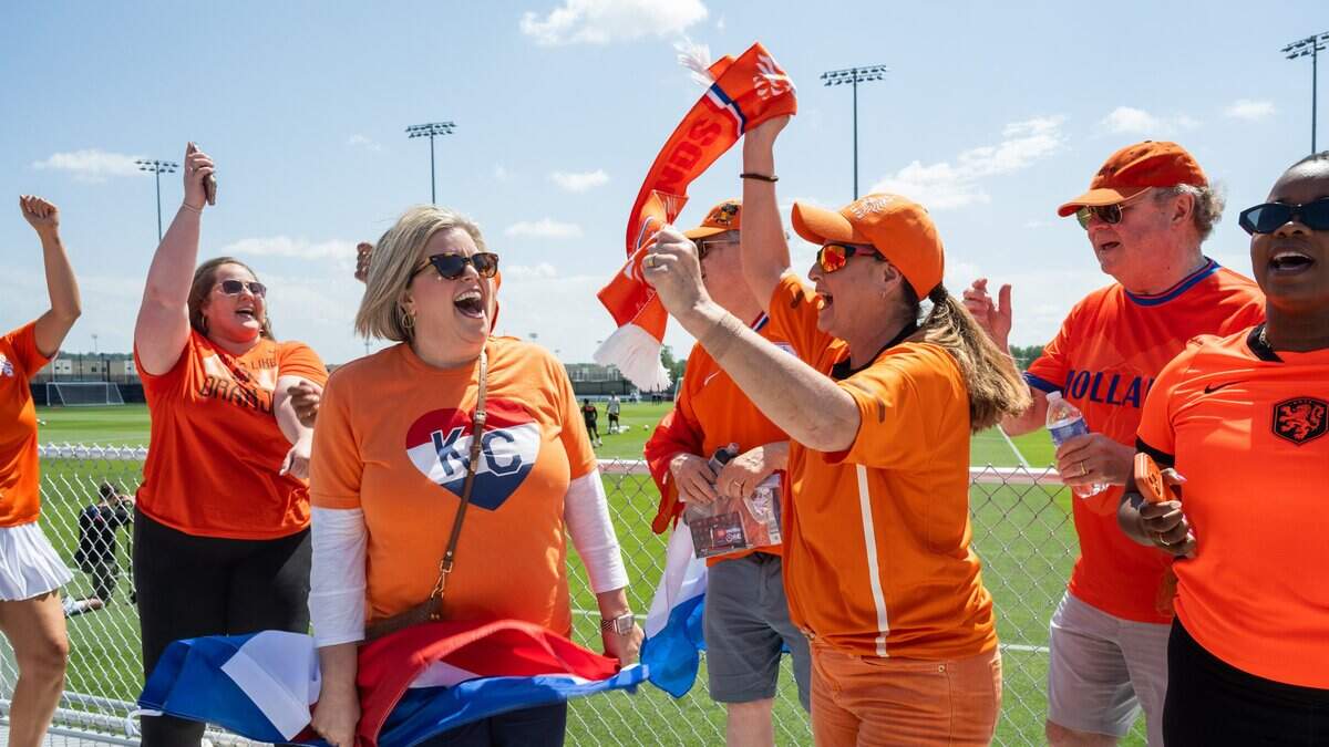 Fans dance in support of the Netherlands soccer team during the team's open practice on Wednesday, June 10, 2026, in Riverside. The Dutch national team will train between matches at the Kansas City Current training facility.